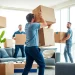 Best Toronto Movers expertly handling furniture in a bright, modern apartment.