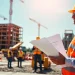 New Jersey Construction Manager supervising a dynamic construction site with workers and machinery.