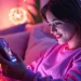 Engaging in AI sexting on a modern device in a cozy atmosphere.