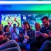 Engaging enthusiasts using sports betting sites Alabama in a vibrant and energetic setting.