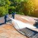 Roof cleaning in Kissimmee, showcasing professionals using soft washing techniques for effective cleaning.